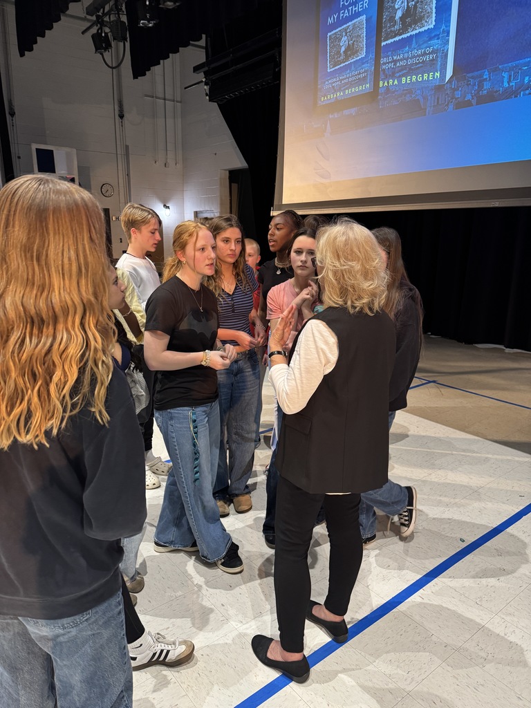 Our guest speaker talking with a small group of interested students