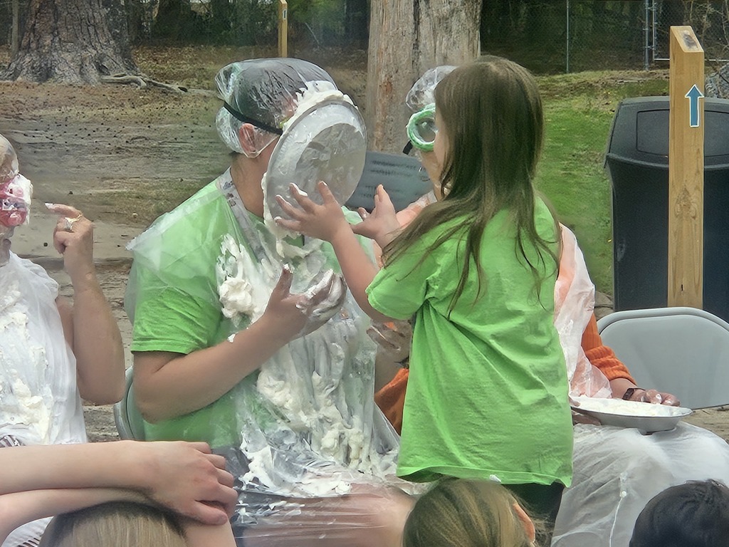 student pieing teacher in the face 