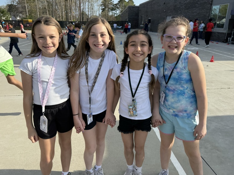 friends holding hands excited to participate in the funrun! 