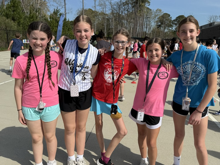friends smiling participating in the fun run! 
