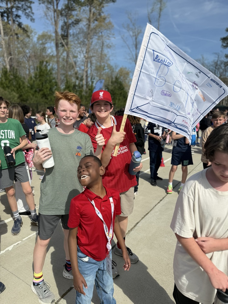 friends posing with their class flag for the funrun! 