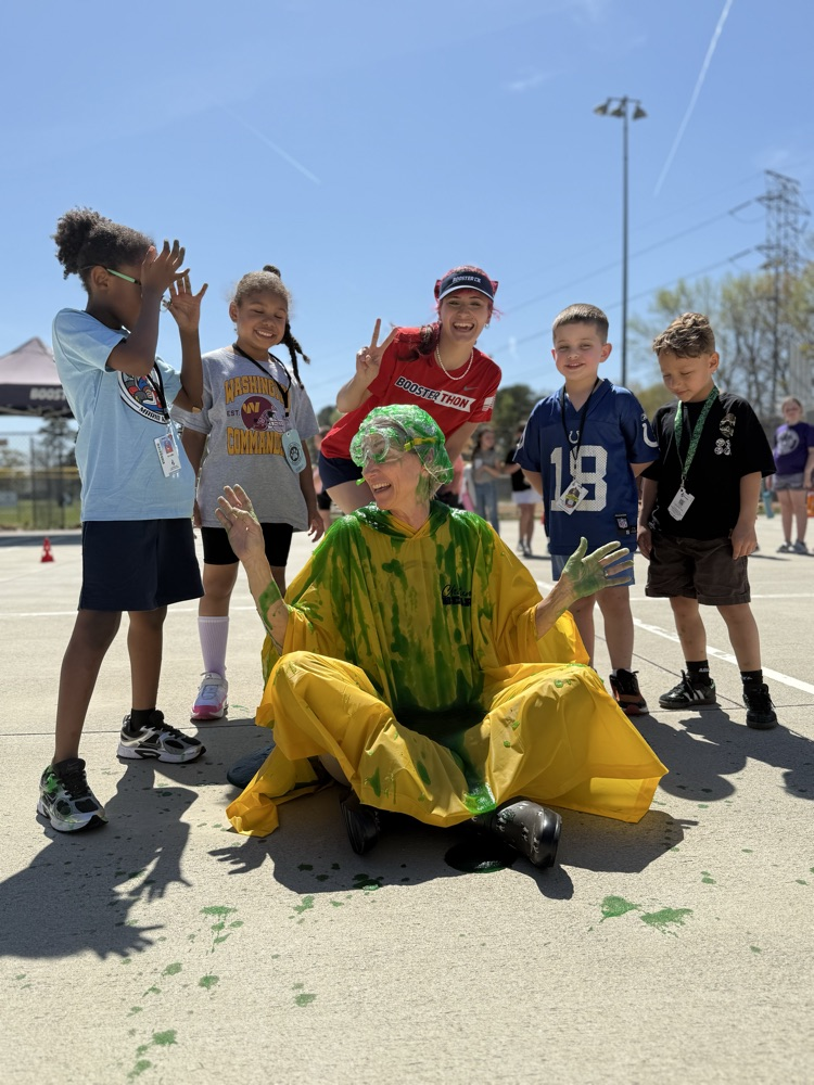 our principal posing with slime on her head! the winners of the funrun got to slime the principal 