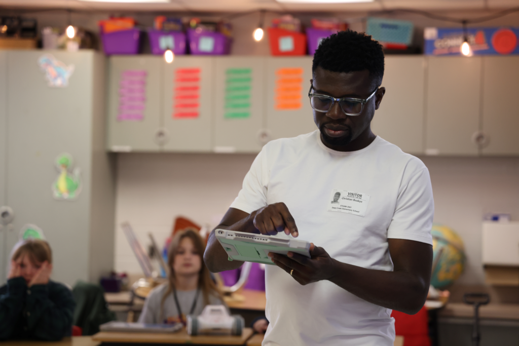 presenter demonstrates coding for STEAM day