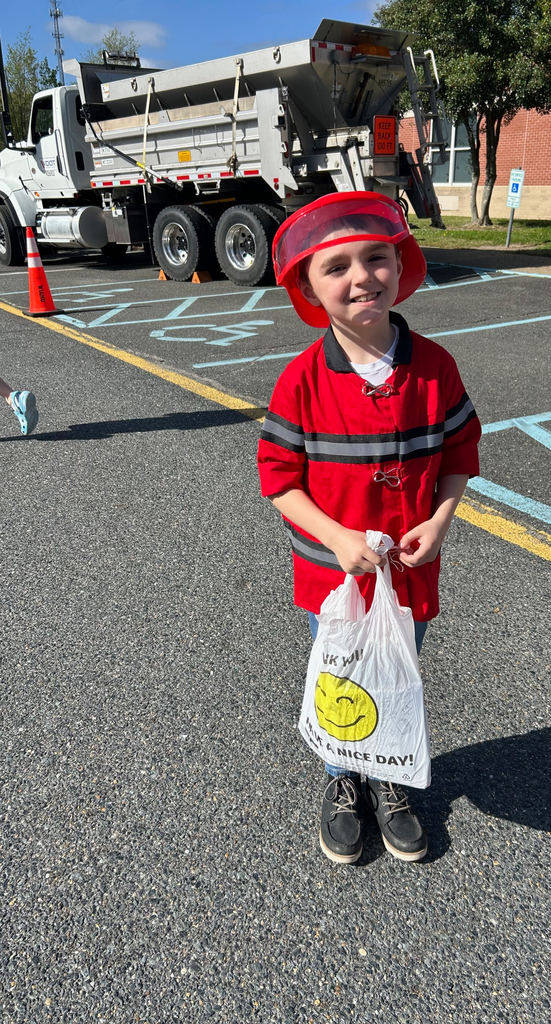 students dressed up as fire fighter for career day 
