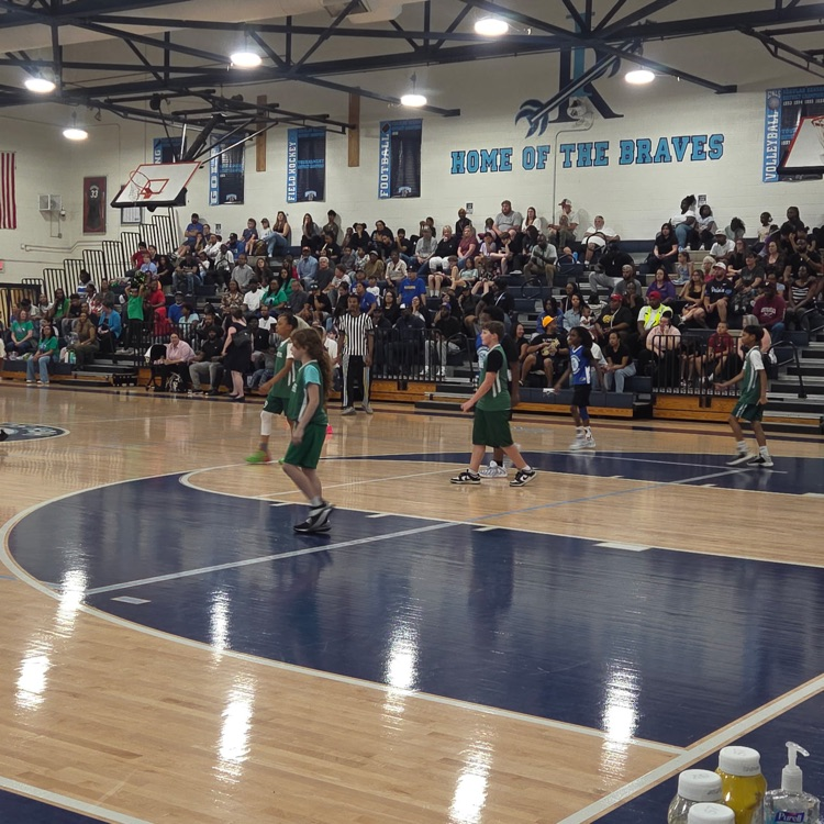 basketball teams on the court playing the game