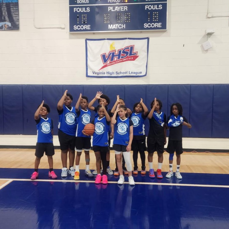 SRI basketball players together on the court