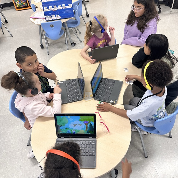 preschoolers and 4th graders playing together 