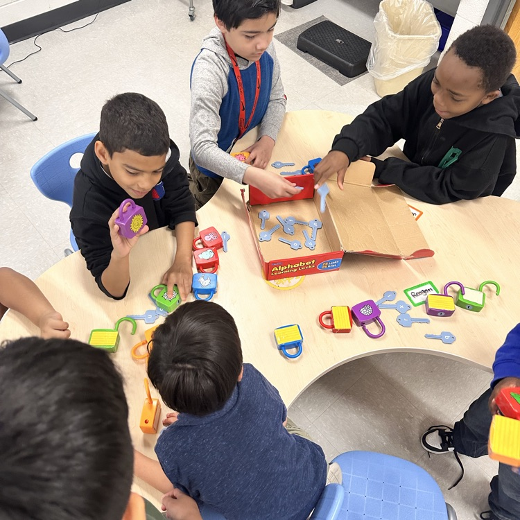 preschoolers and 4th graders playing together 
