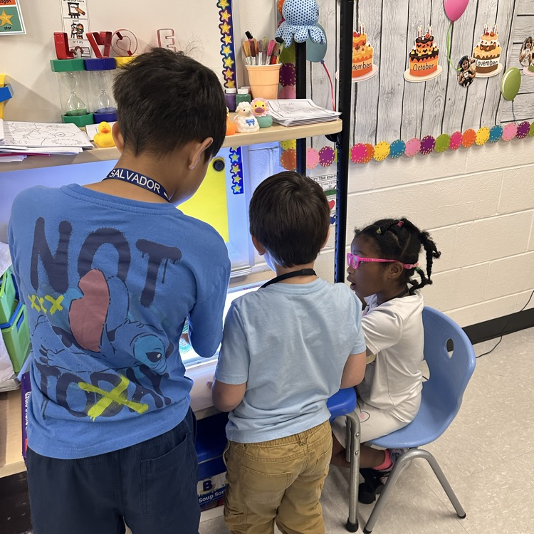 preschoolers and 4th graders playing together 