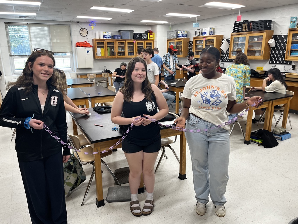Students displaying their paper chains
