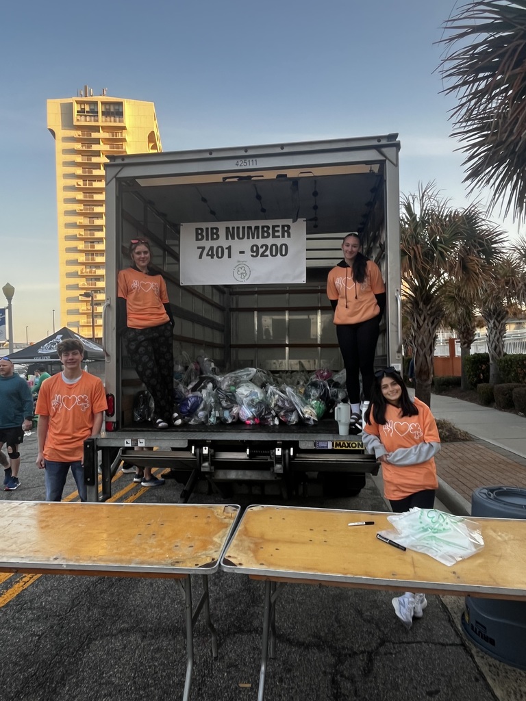 DCHS Choral students assisting with dry bags at the Shamrock-n-Run in Virginia Beach.