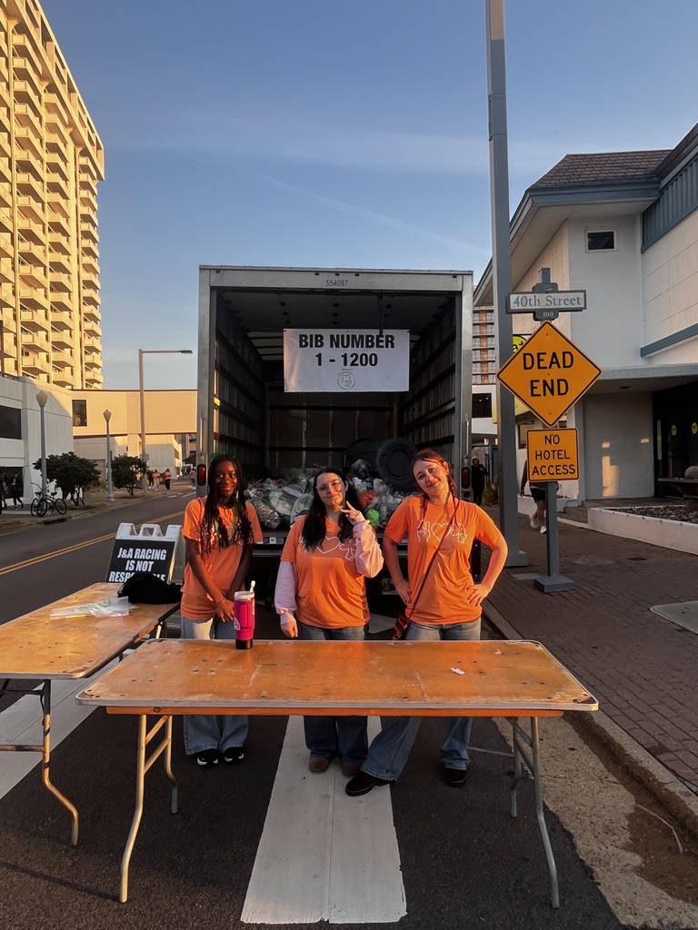 DCHS Choral students assisting with dry bags at the Shamrock-n-Run in Virginia Beach.
