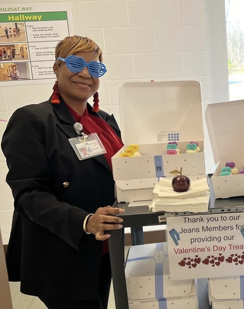 Ms. Baker-Hardison delivering a Valentine's Day treat to staff members