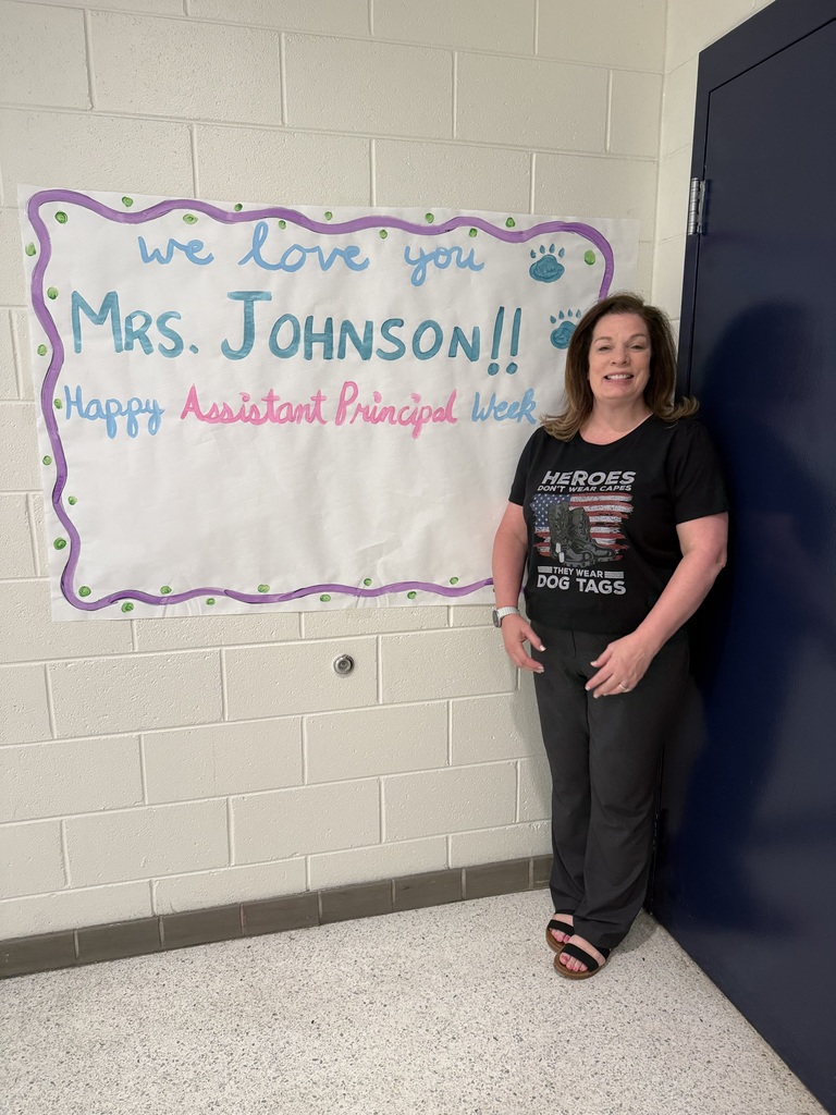 the assistant principal with a sign showing appreciation