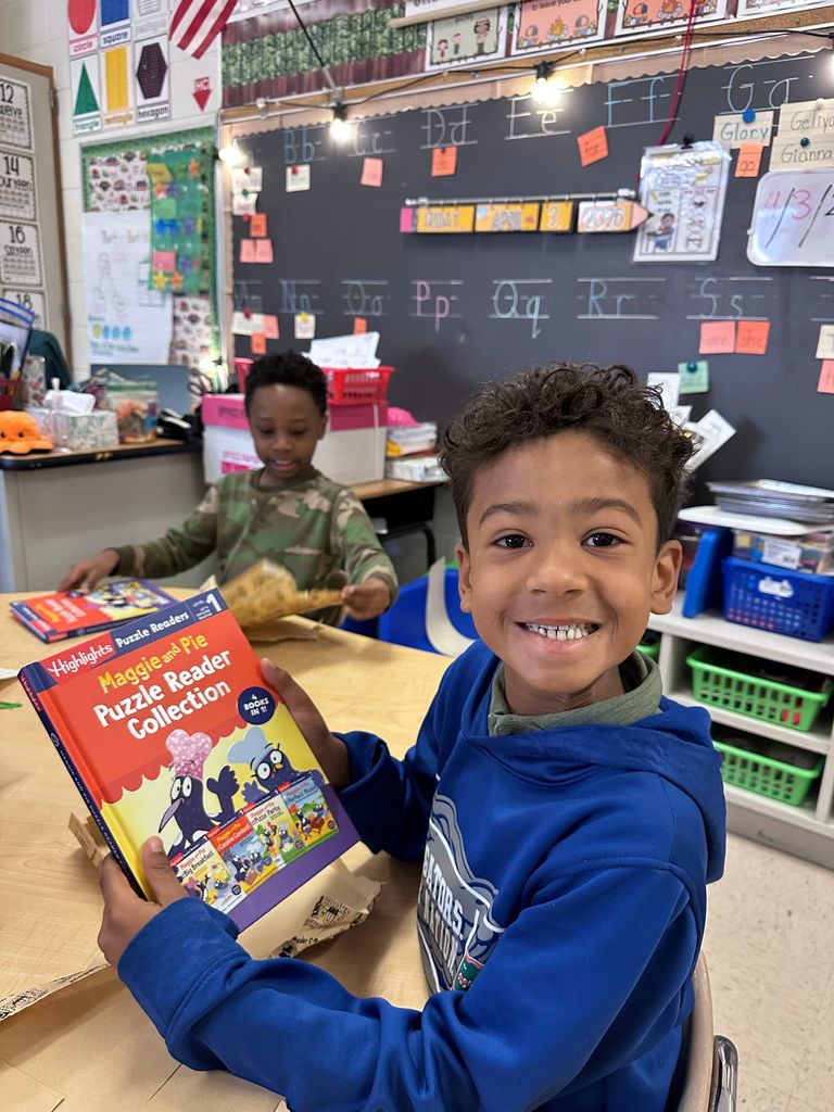 students with books and prizes