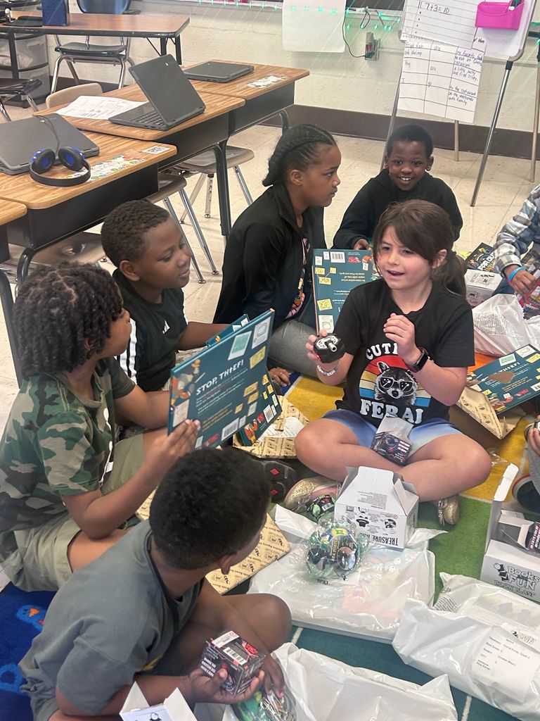 students with books and prizes