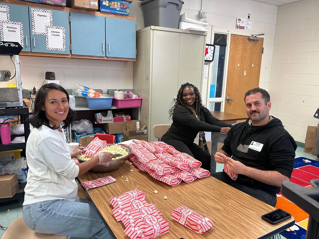 volunteers making popcorn