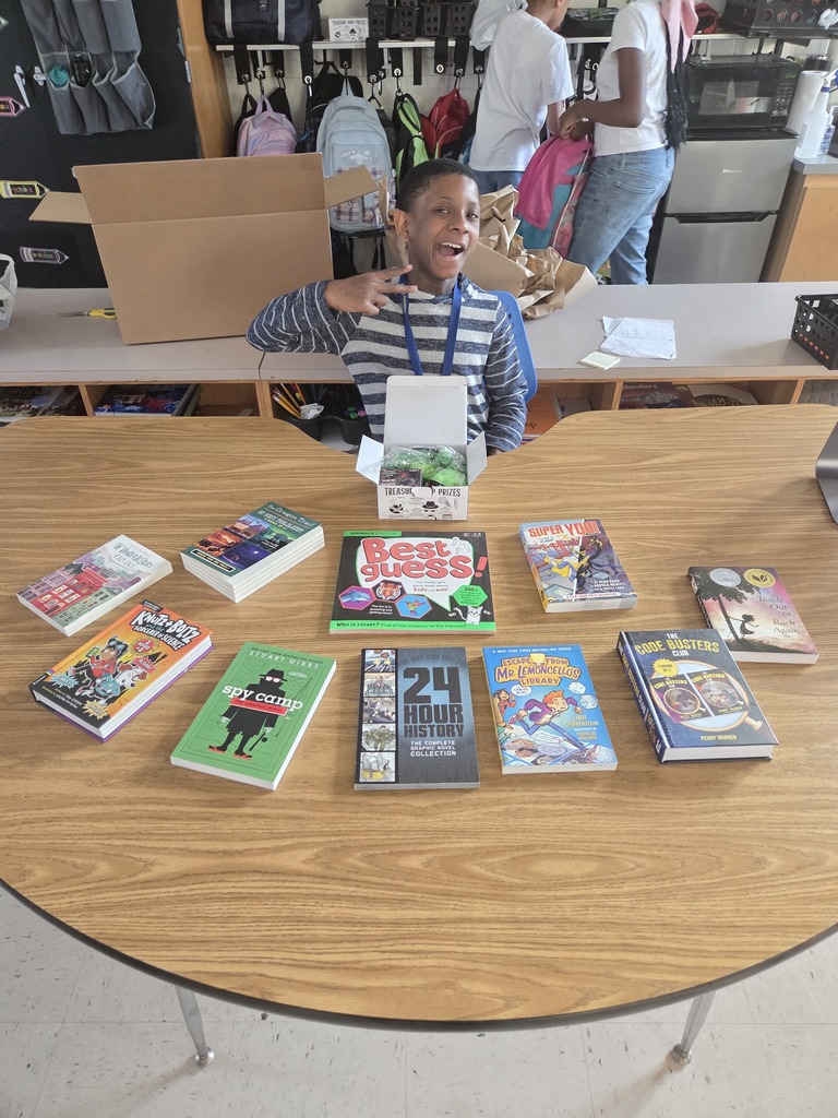 students with books and prizes