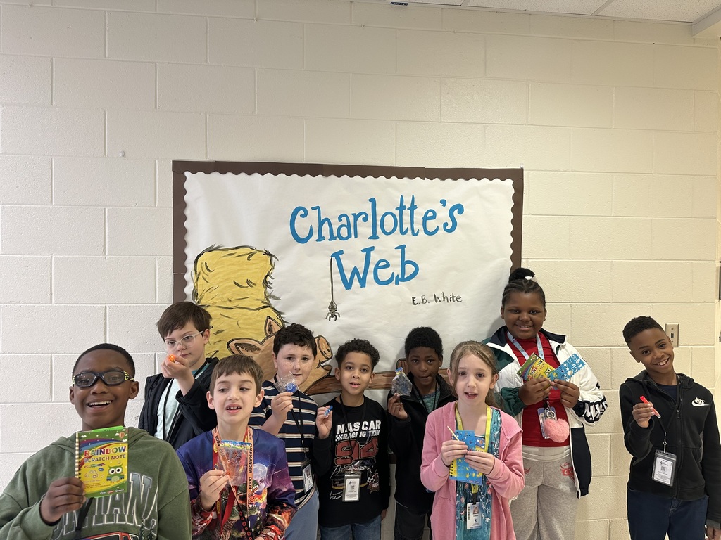 students with books and prizes