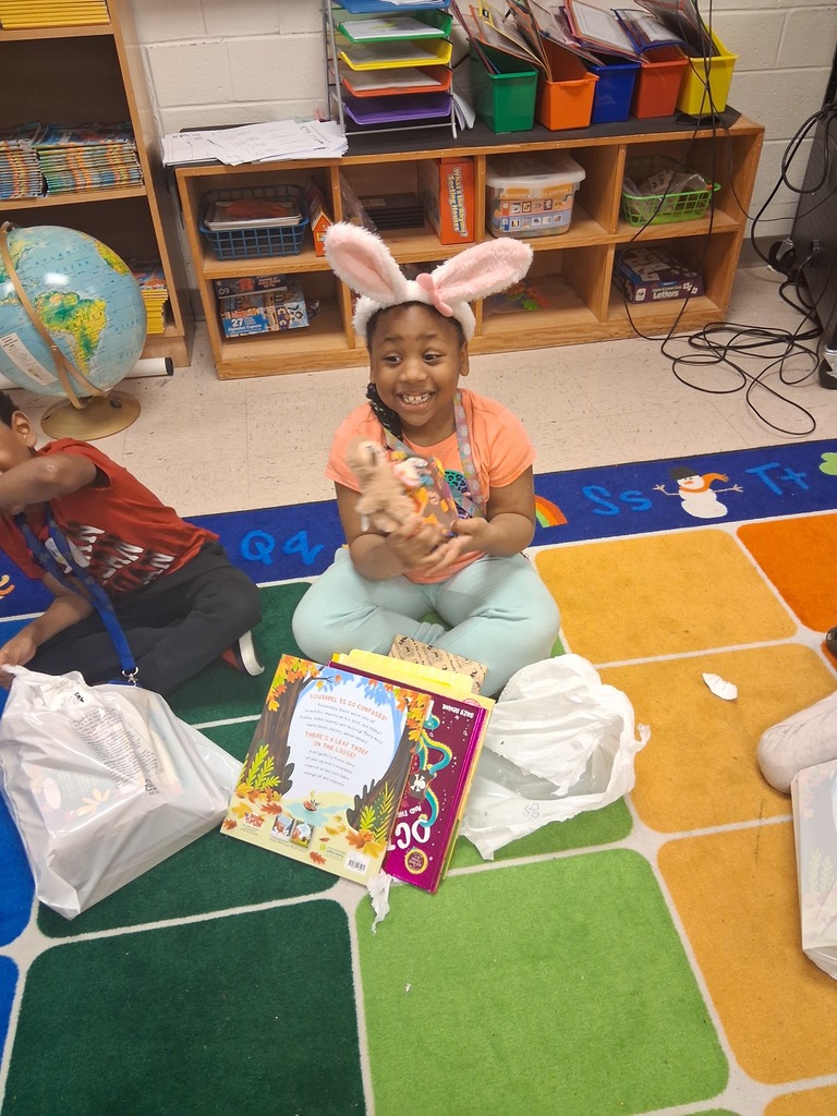 students with books and prizes