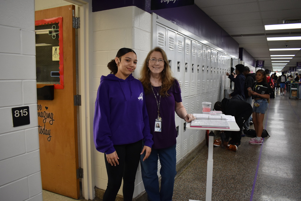 A teacher and a student wearing their purple to celebrate the Month of the Military Family.