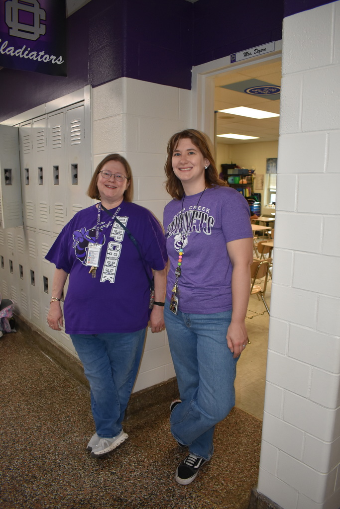 Two teachers wearing their purple to celebrate the Month of the Military Family.
