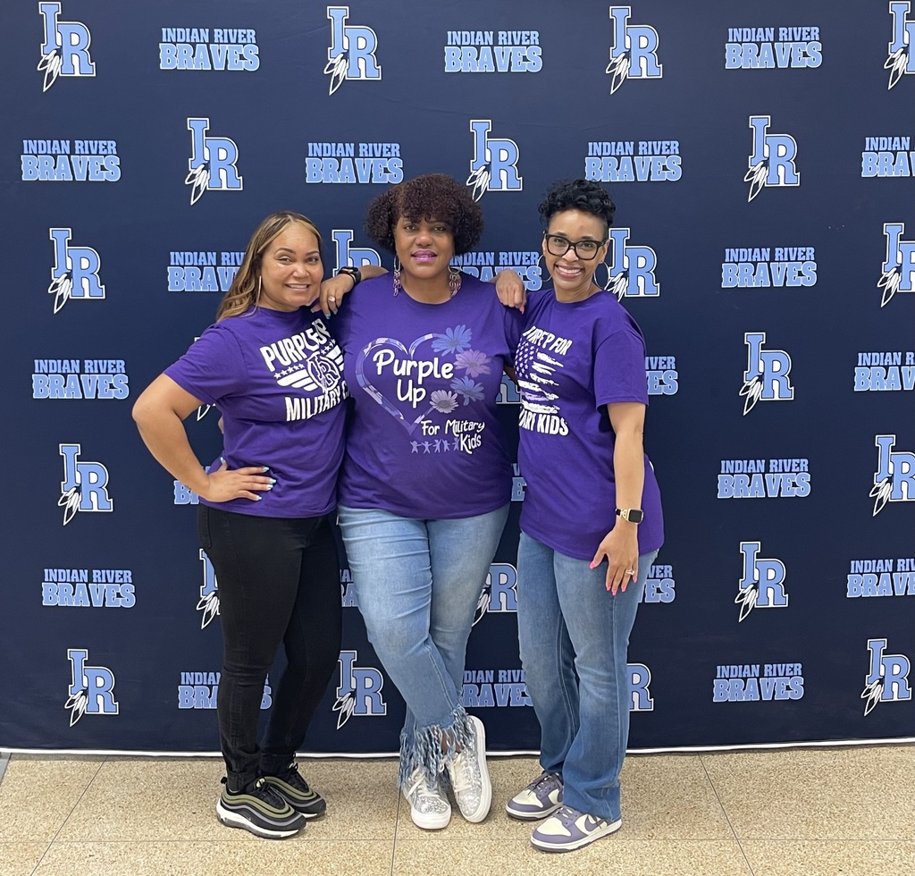 students and staff at Indian River MIddle School wearing purple for purple up day to support military children