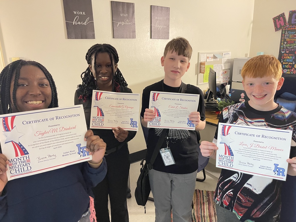 students and staff at Indian River MIddle School wearing purple for purple up day to support military children