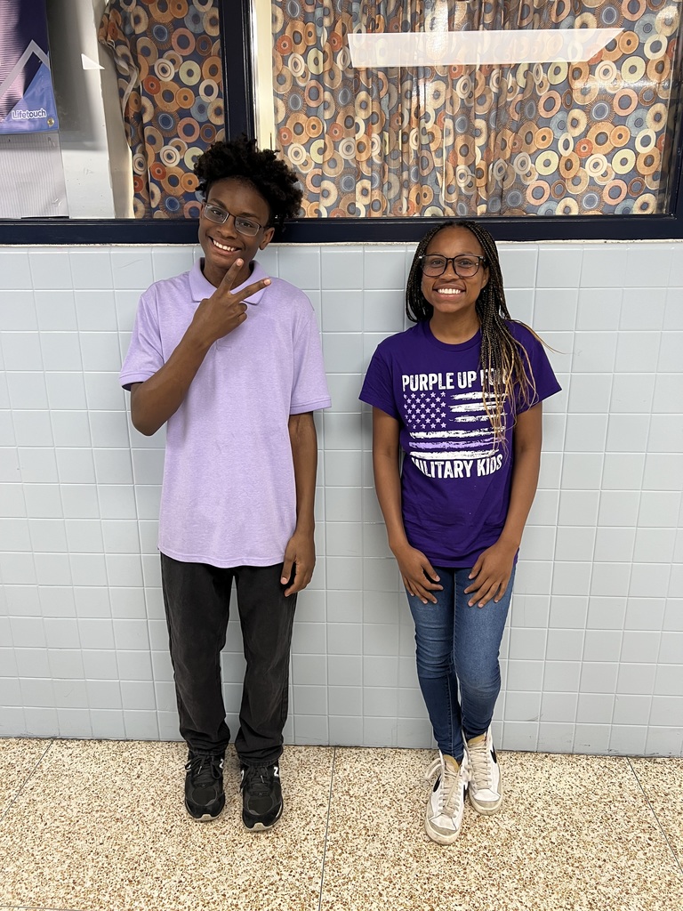 students and staff at Indian River MIddle School wearing purple for purple up day to support military children