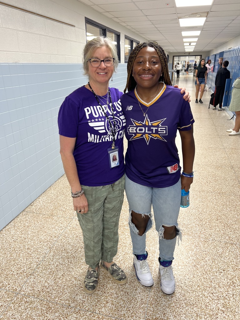 students and staff at Indian River MIddle School wearing purple for purple up day to support military children