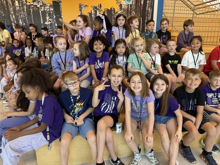 Kids gathered for the month of the Military Kid Parade, wearing purple for purple up day! 