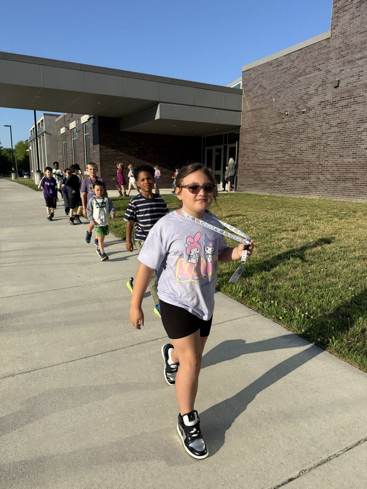 kids smiling walking in the parade to recognize the month of the military children! 