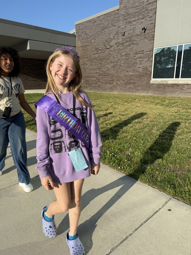 kids smiling walking in the parade to recognize the month of the military children! 