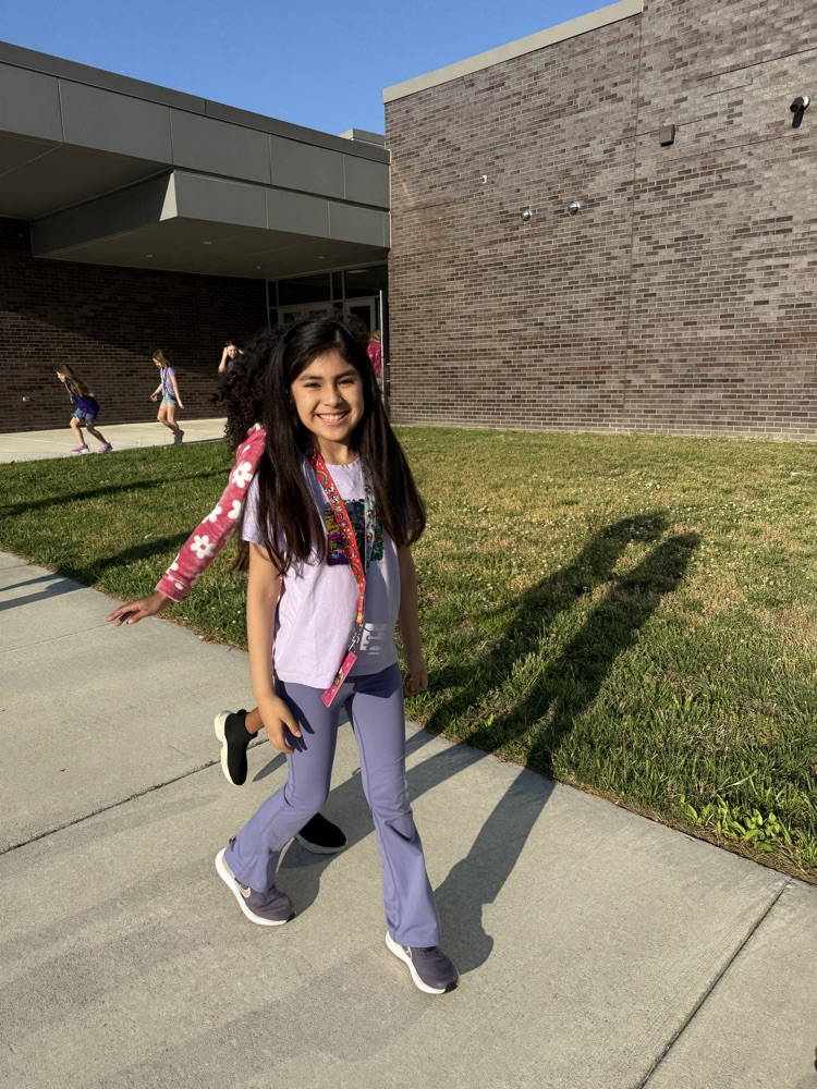 kids smiling walking in the parade to recognize the month of the military children! 