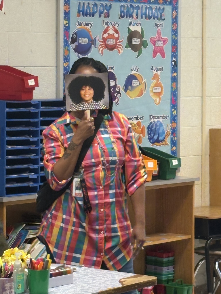 staff member posing with a Mrs. Battle fan