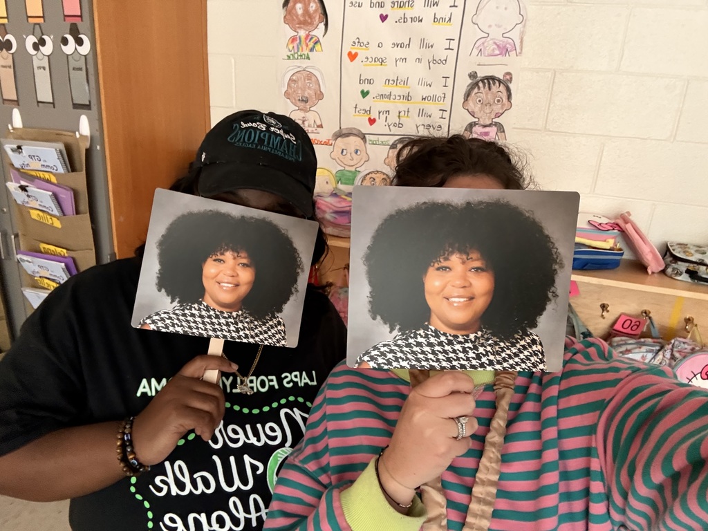 staff members posing with their Mrs Battle fans