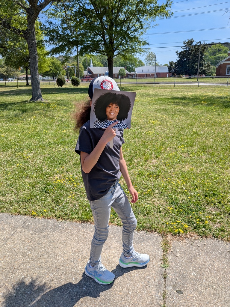 student posing with his Mrs Battle fan