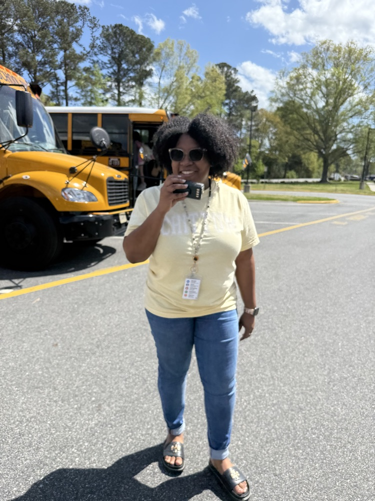 Recognizing our administrative   specialist during AP week! She is smiling outside at the bus ramp.