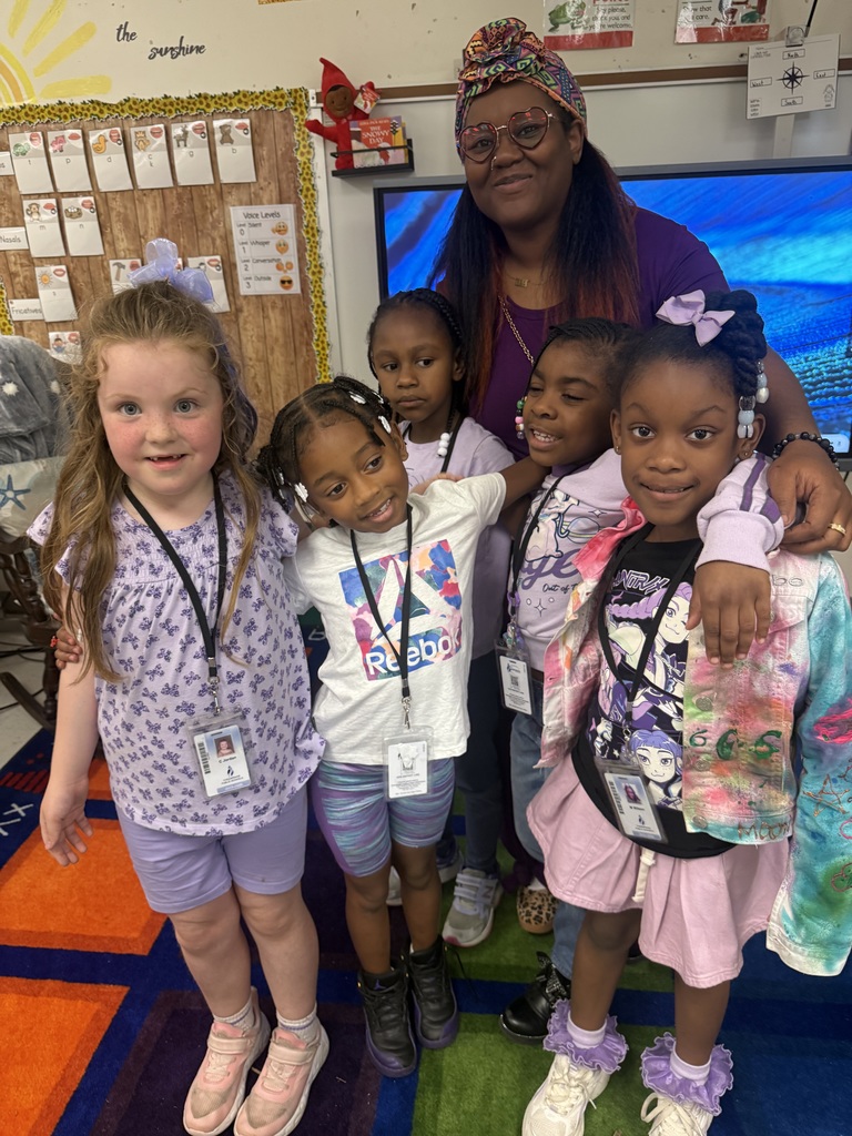 students and staff wearing purple for purple up day