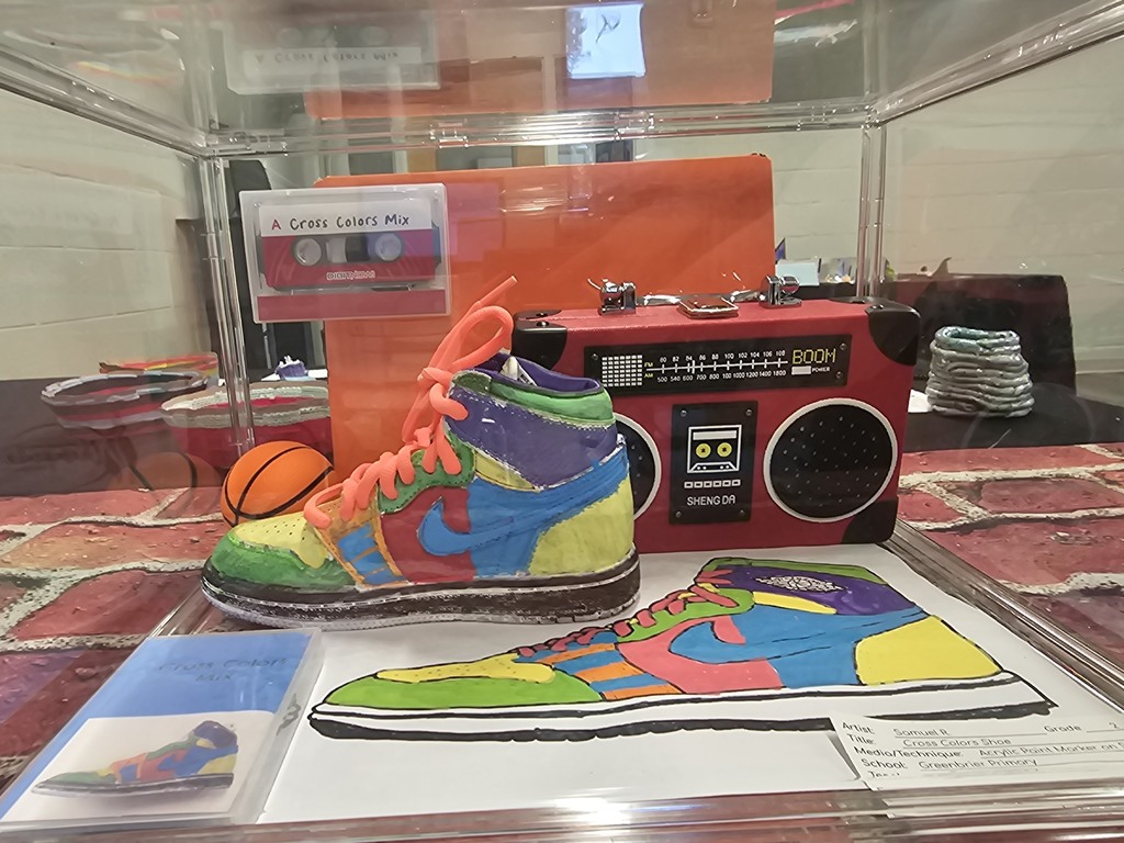 Student artwork on display. Sneakers and radio in 3d form