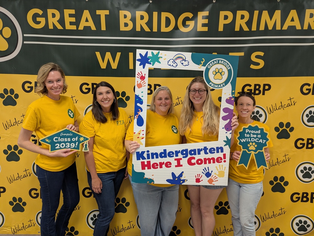 PTA board members standing together and smiling at Kindergarten Kickoff, representing the school’s parent-teacher organization and welcoming families to the event.