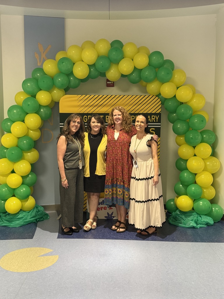 Kindergarten teachers smiling and greeting families at Kindergarten Kickoff, helping welcome incoming students and sharing information about the upcoming school year.