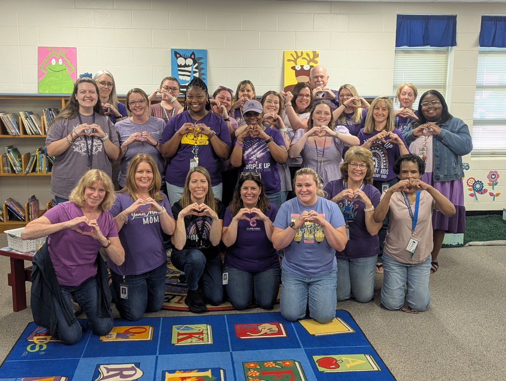 RBW staff dressed in purple for out month of the military childs.