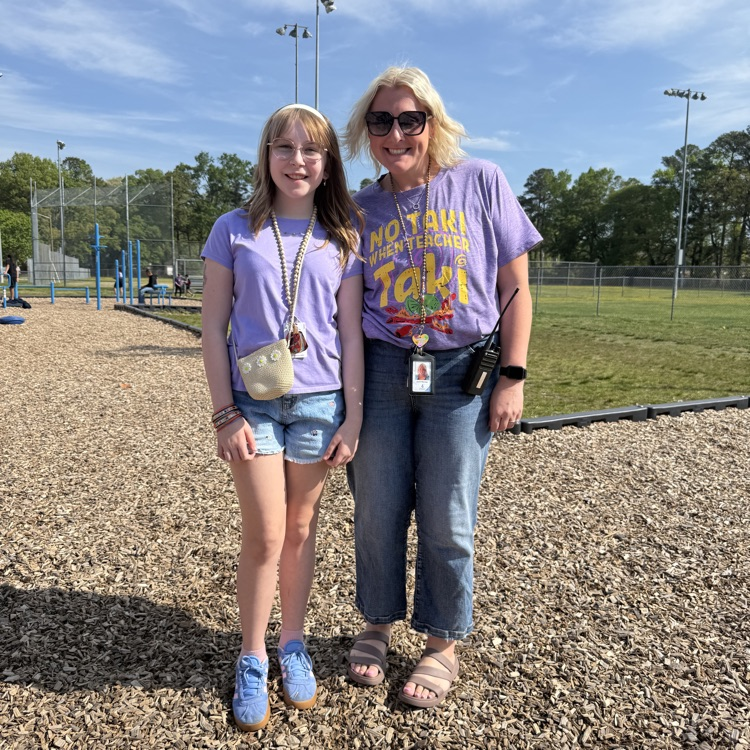 Ms. Warner and a student showing off their  purple. 