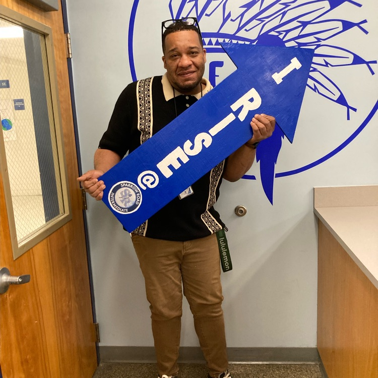 Mr. Monger holding up the “I rise” arrow. 