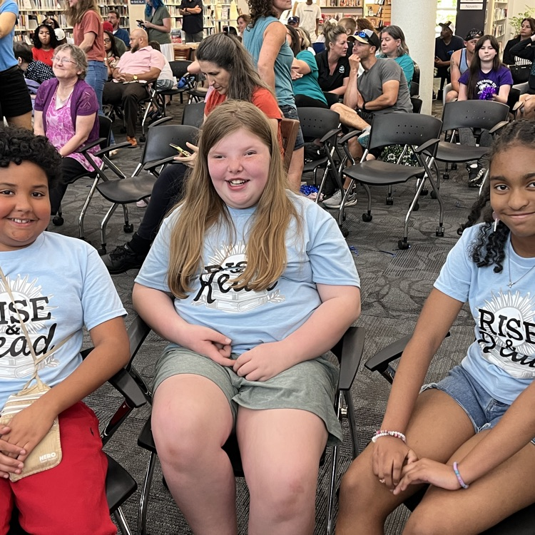 students smiling awaiting the competition