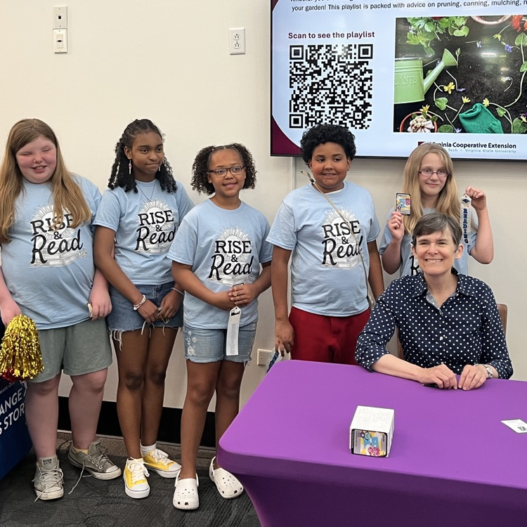 students smiling with author CeCe Bell