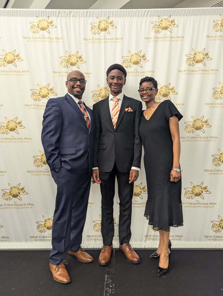 our honored student proudly standing with his parents
