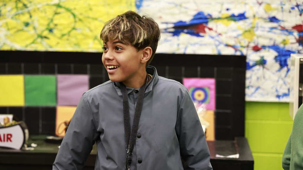 A student smiling during a science lesson