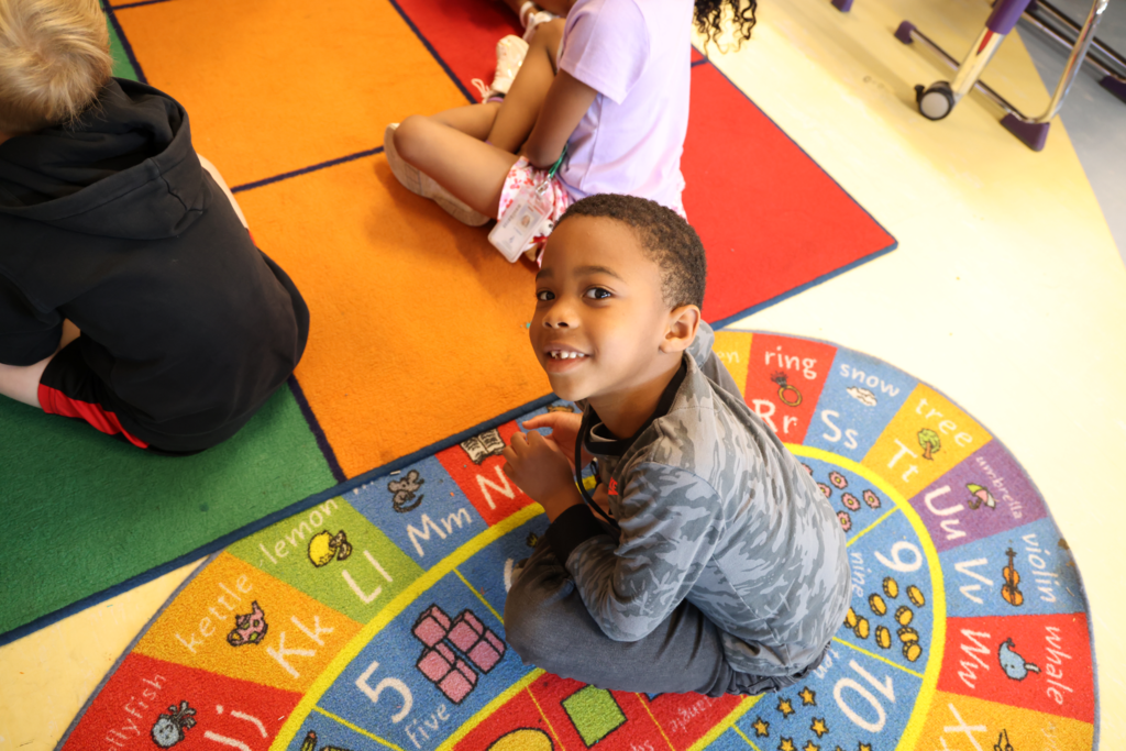 primary student waits patiently for reading to begin